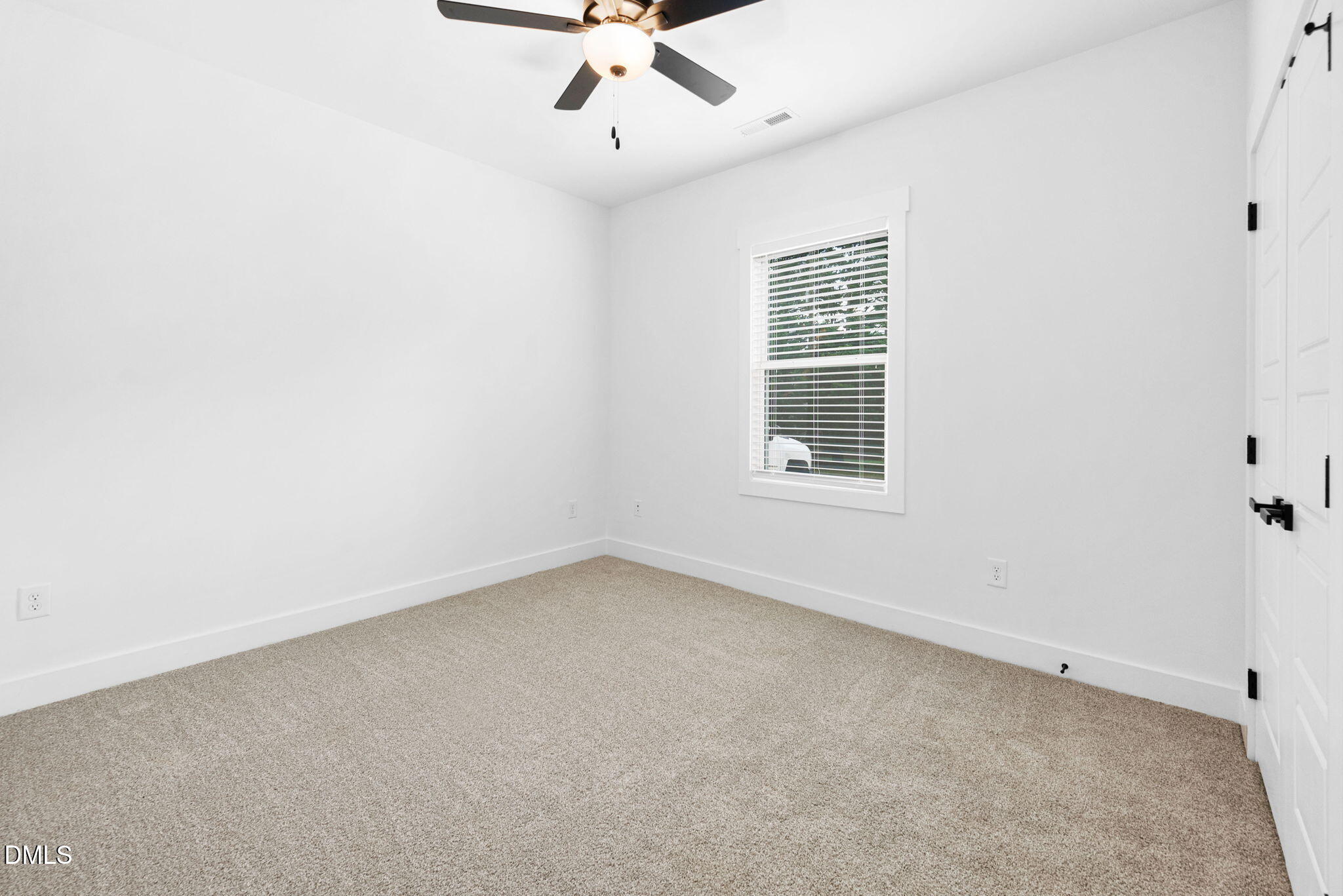 305 West Barden Street Roxboro, NC 27573 - Photo 20 of 31 an empty room with a window