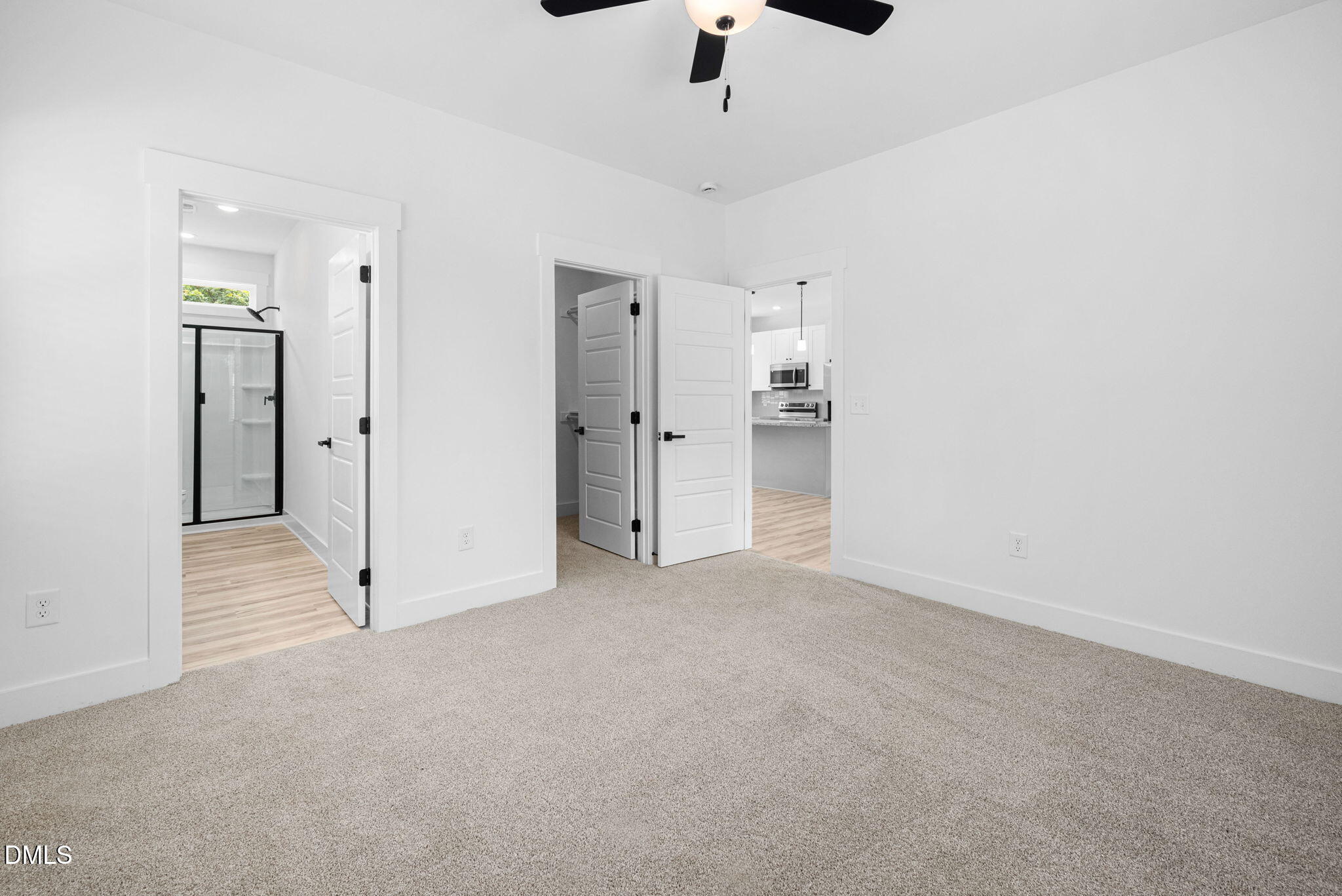 305 West Barden Street Roxboro, NC 27573 - Photo 24 of 31 an empty room with chandelier fan and refrigerator