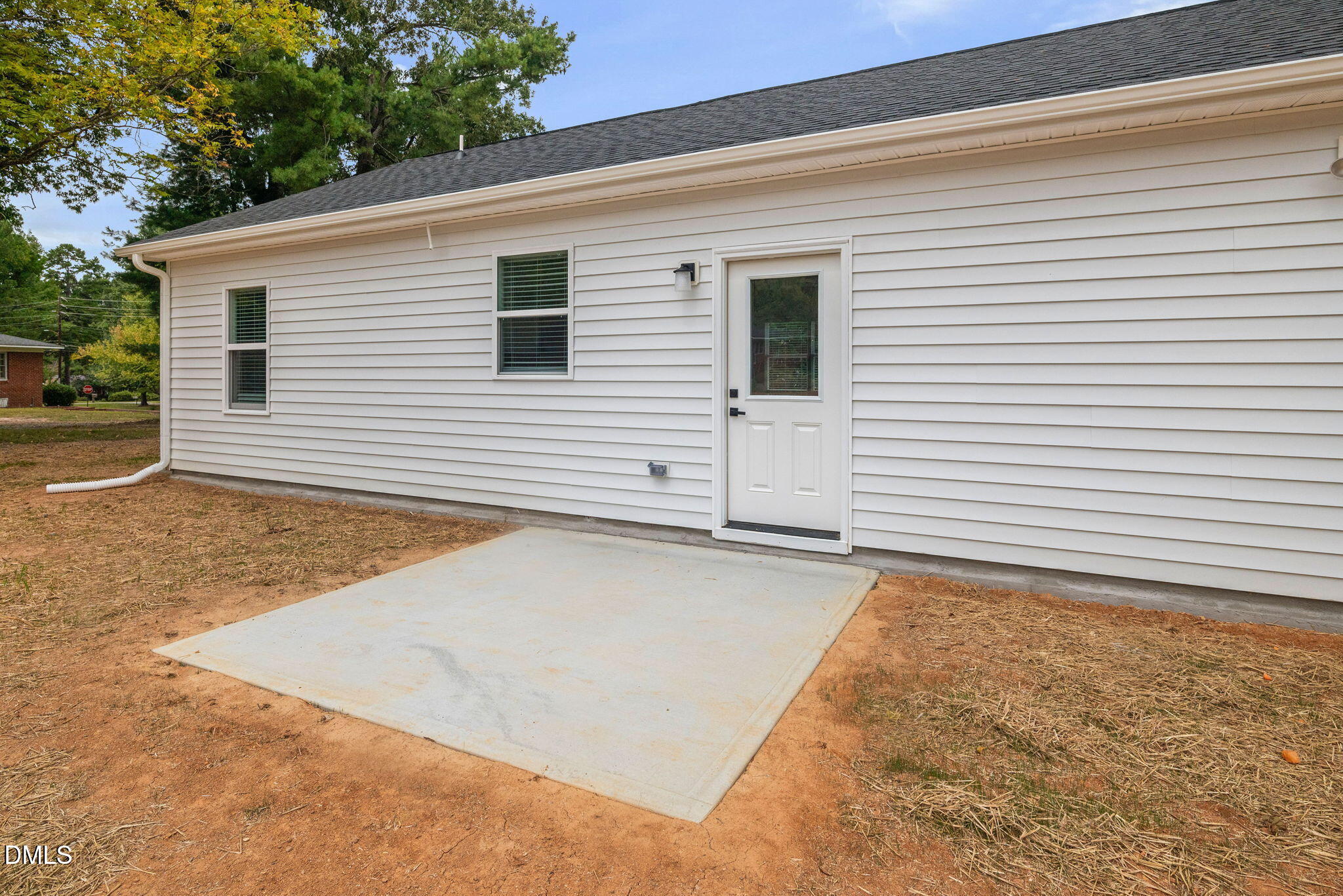 305 West Barden Street Roxboro, NC 27573 - Photo 28 of 31 a view of a house with a backyard