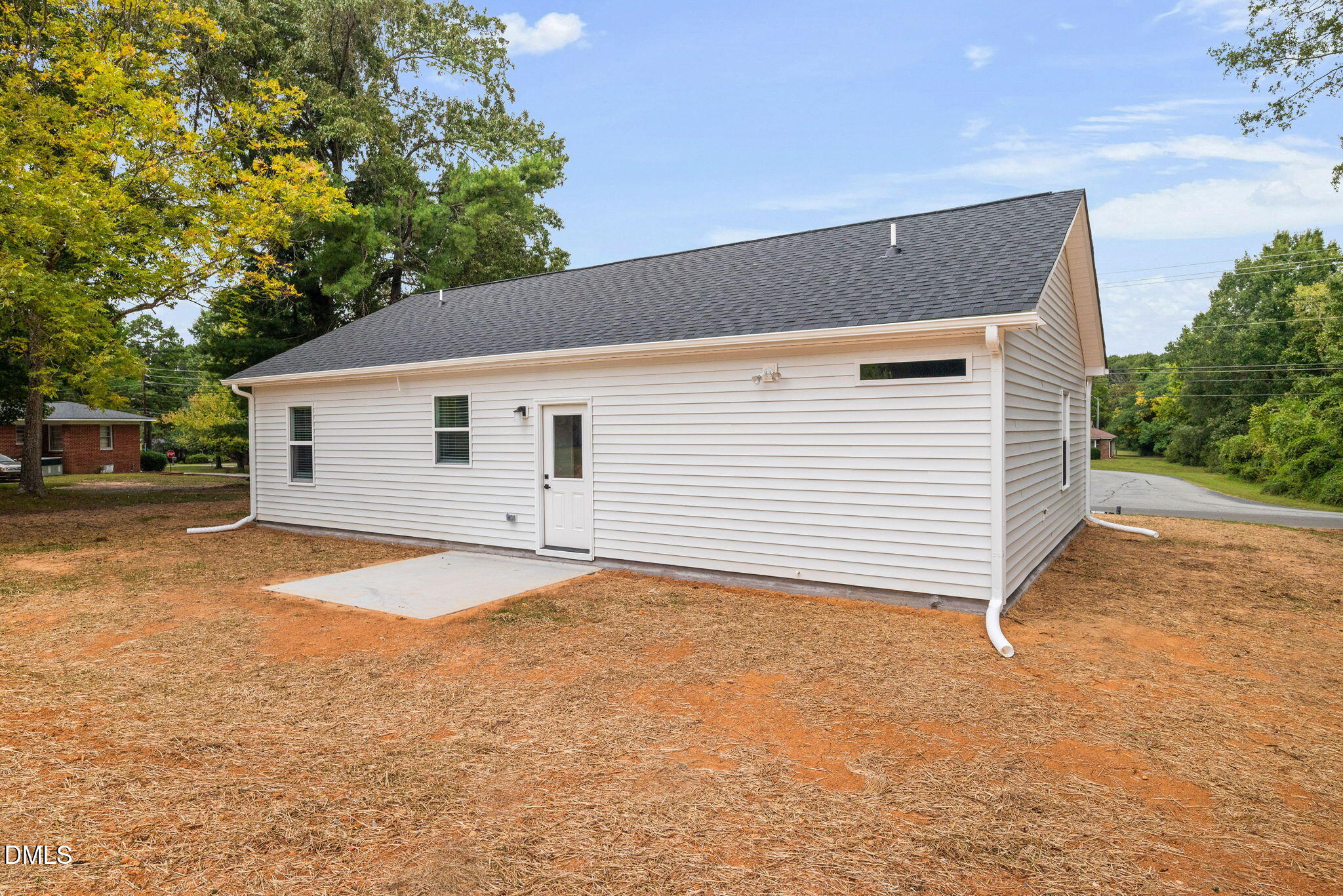 305 West Barden Street Roxboro, NC 27573 - Photo 30 of 31 a view of a house with a backyard and garage