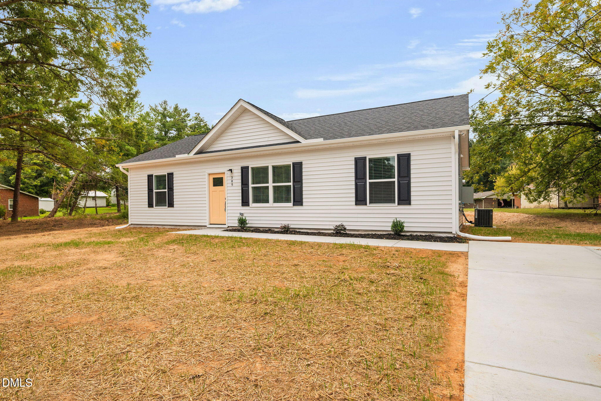 305 West Barden Street Roxboro, NC 27573 - Photo 6 of 31 a front view of house with yard and trees around
