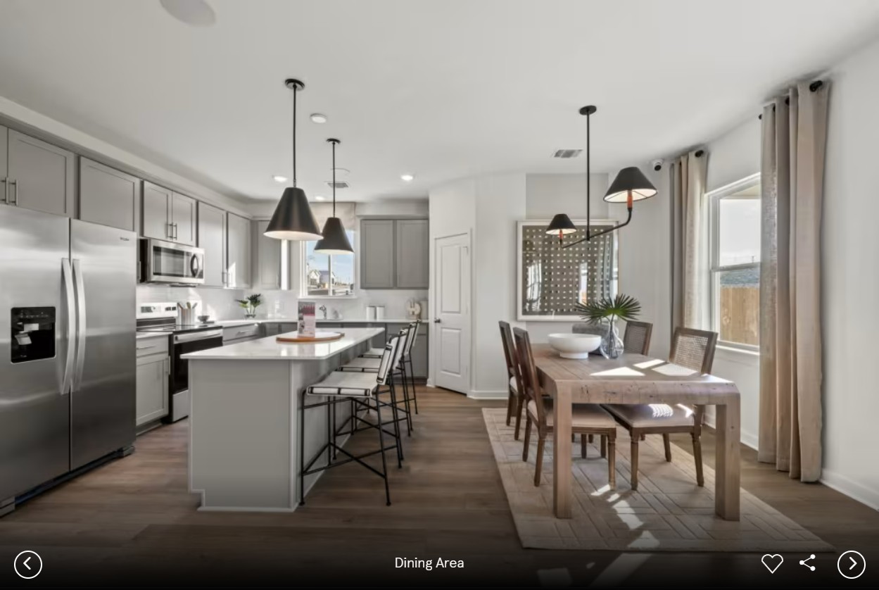 1363 Big Sky Road Belton, TX 76513 - Photo 5 of 8 a kitchen with stainless steel appliances kitchen island granite countertop a table chairs and a refrigerator