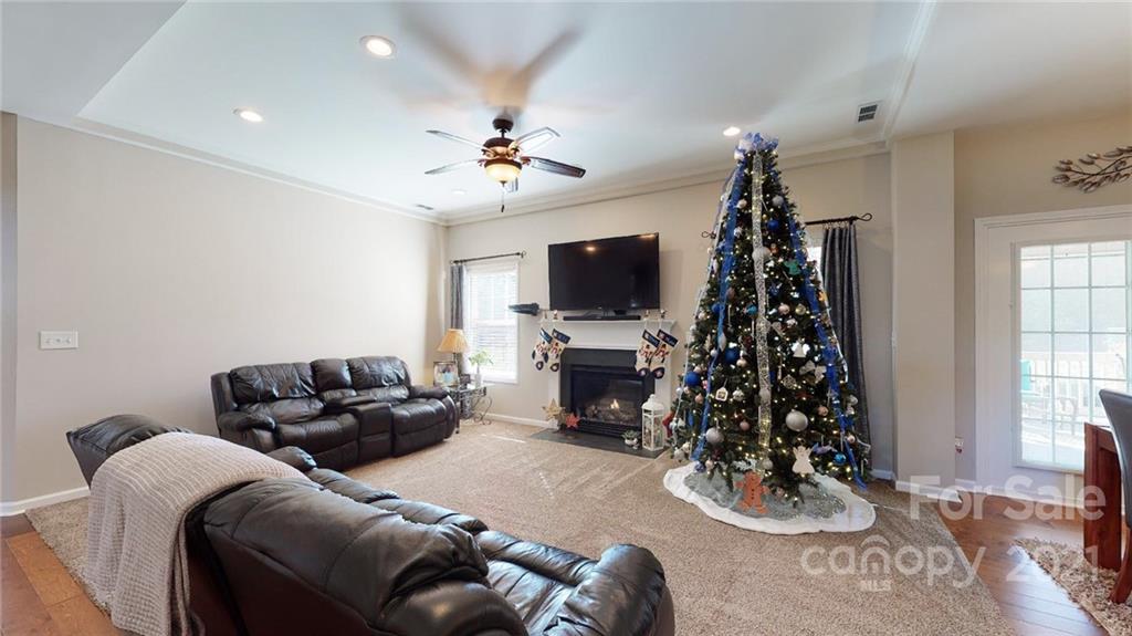 1012 Dunbarton Road Indian Trail, NC 28079 - Photo 14 of 48 a living room with furniture and a flat screen tv