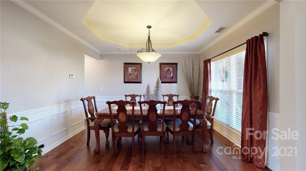 1012 Dunbarton Road Indian Trail, NC 28079 - Photo 8 of 48 a view of a dining room with furniture window and wooden floor