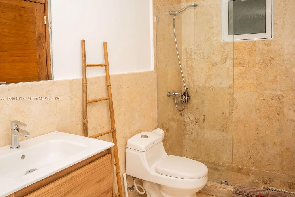 0 8c3f Q62 Las Terrenas Drive, Unit 2 Las Terrenas, Samaná Province 32000 - Photo 16 of 38 a bathroom with a sink a toilet and shower