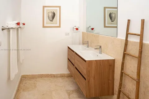 a bathroom with a sink and mirror