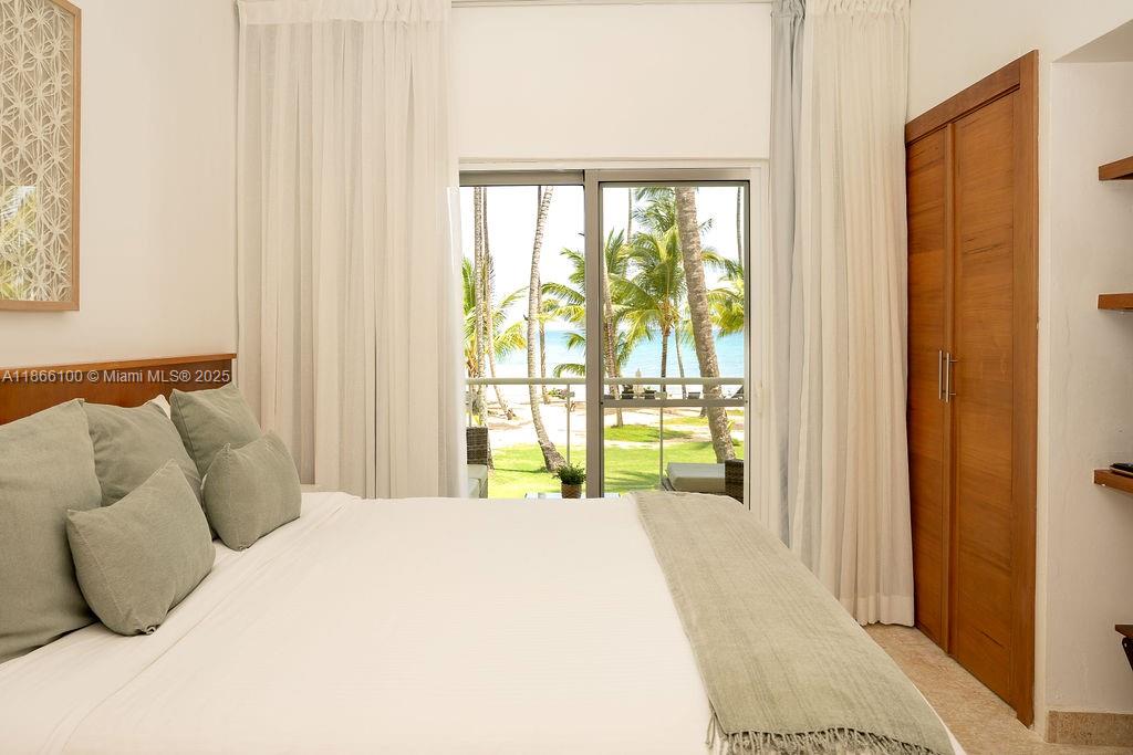 0 8c3f Q62 Las Terrenas Drive, Unit 2 Las Terrenas, Samaná Province 32000 - Photo 18 of 38 a bedroom with a bed and large window
