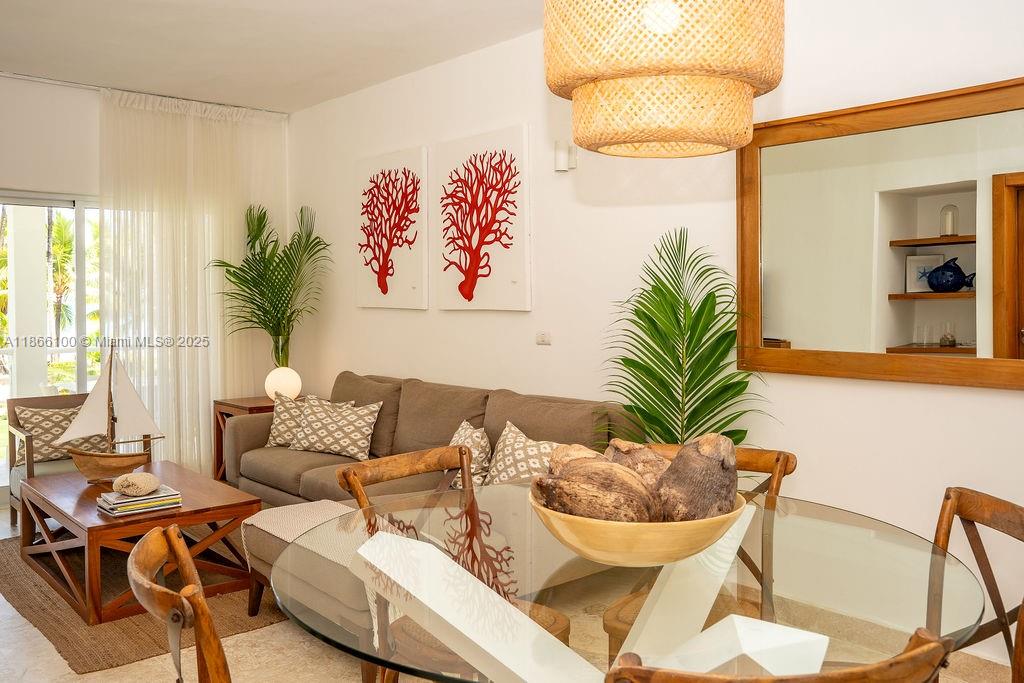 0 8c3f Q62 Las Terrenas Drive, Unit 2 Las Terrenas, Samaná Province 32000 - Photo 2 of 38 a living room with furniture and a large window