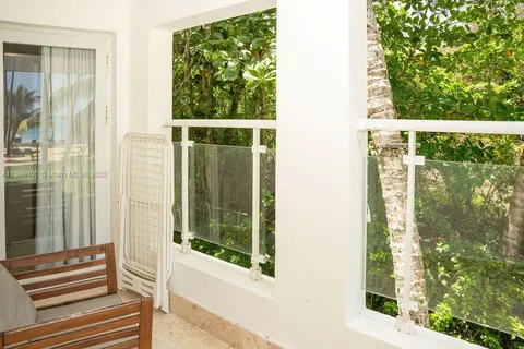 a view of a door and a window