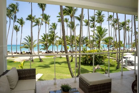 a swimming pool with outdoor seating and yard