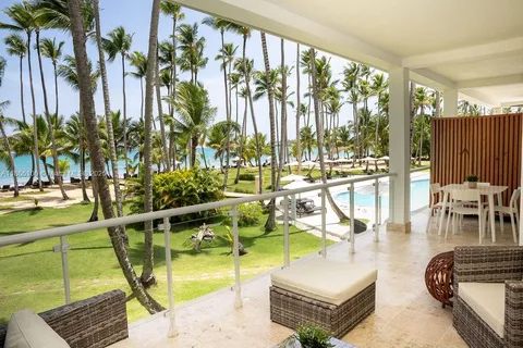 a view of swimming pool with outdoor seating and plants