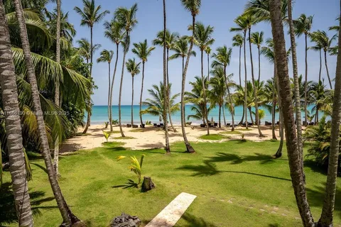 a view of swimming pool with a table and chairs