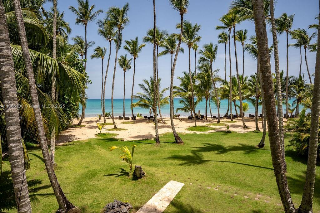 0 8c3f Q62 Las Terrenas Drive, Unit 2 Las Terrenas, Samaná Province 32000 - Photo 37 of 38 a view of swimming pool with a table and chairs