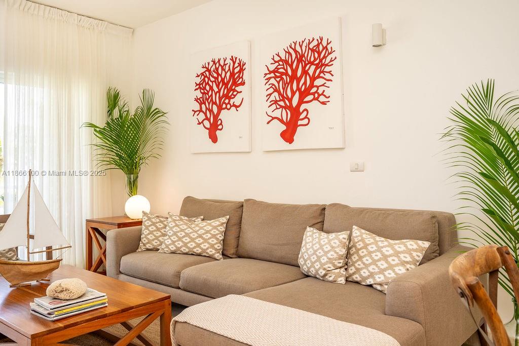 0 8c3f Q62 Las Terrenas Drive, Unit 2 Las Terrenas, Samaná Province 32000 - Photo 6 of 38 a living room with furniture and a potted plant