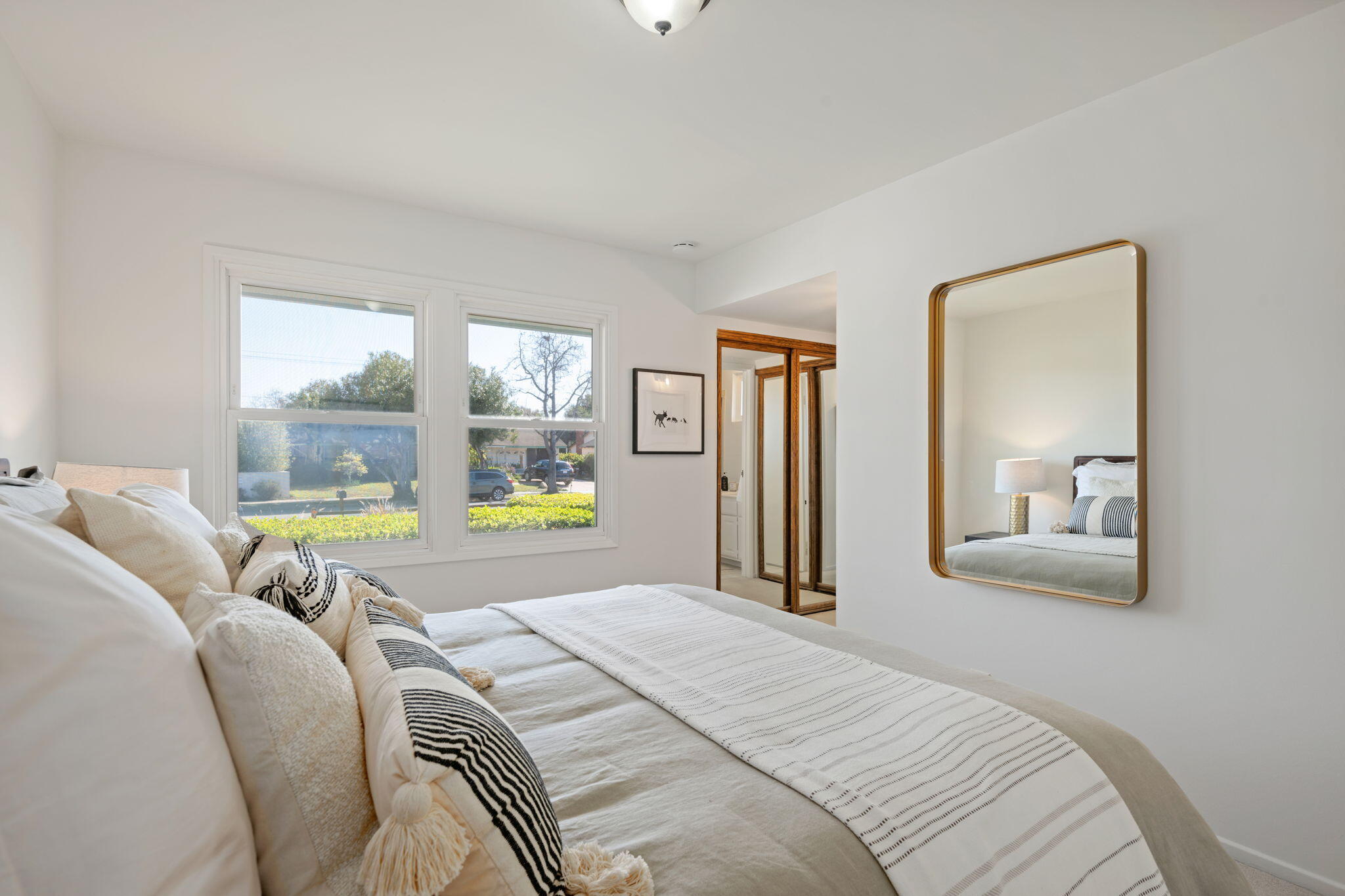 515 Amherst Drive Goleta, CA 93117 - Photo 13 of 24 a bed sitting in a bedroom next to a window