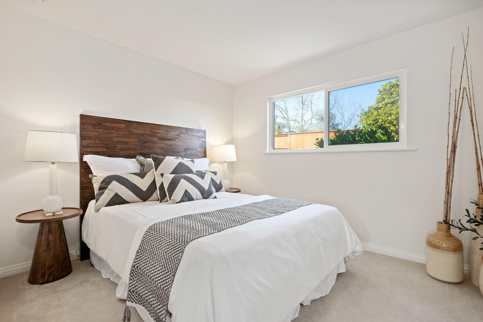 515 Amherst Drive Goleta, CA 93117 - Photo 15 of 24 a bedroom with a bed and glass window