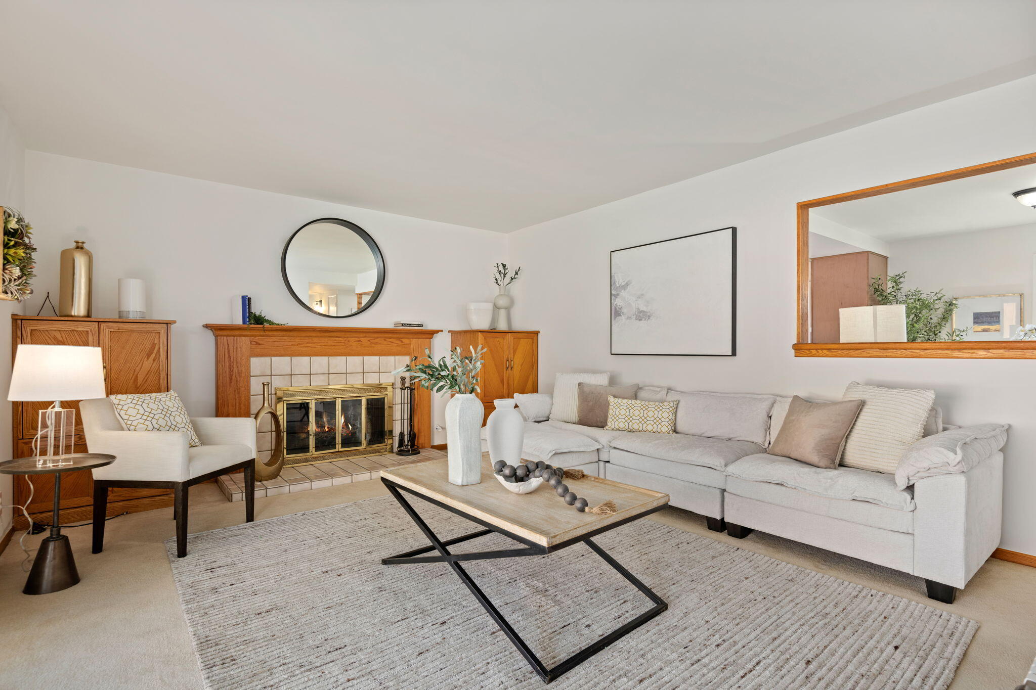 515 Amherst Drive Goleta, CA 93117 - Photo 5 of 24 a living room with furniture a fireplace and a large window