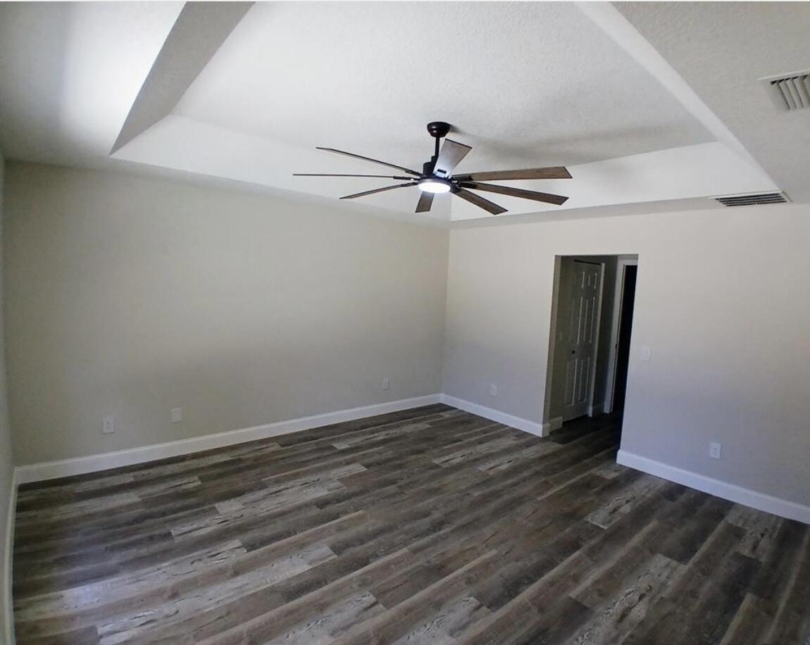 3450 Southwest Martin Street Port St. Lucie, FL 34953 - Photo 7 of 7 wooden floor in an empty room