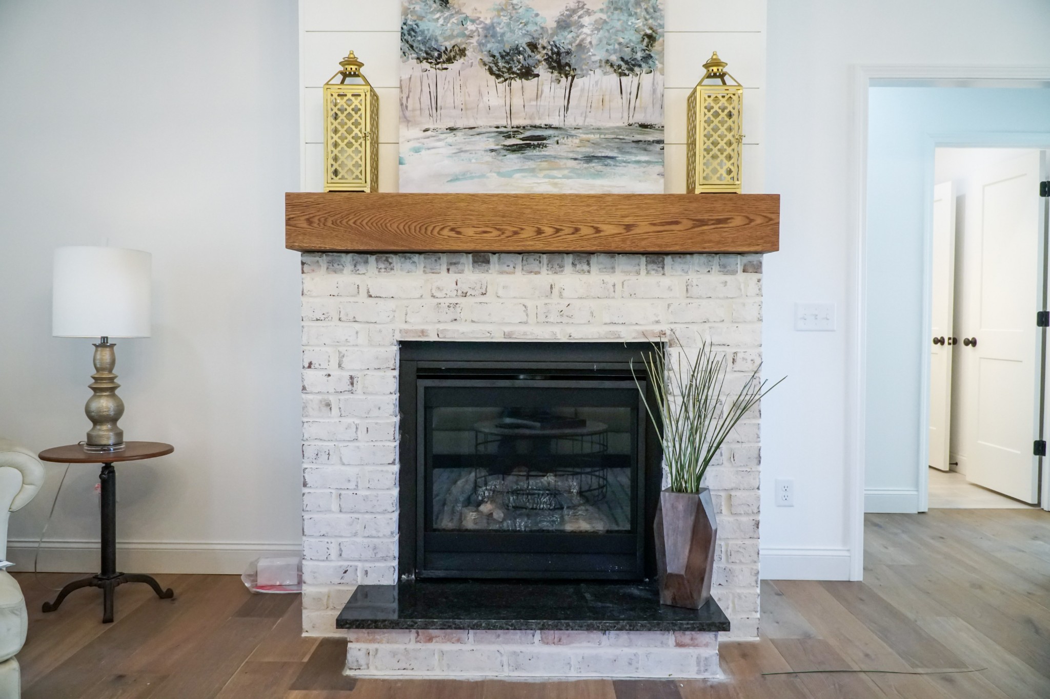 8203 Cookeville Boatdock Road Baxter, TN 38544 - Photo 12 of 64 a living room with a fireplace and a wooden floor