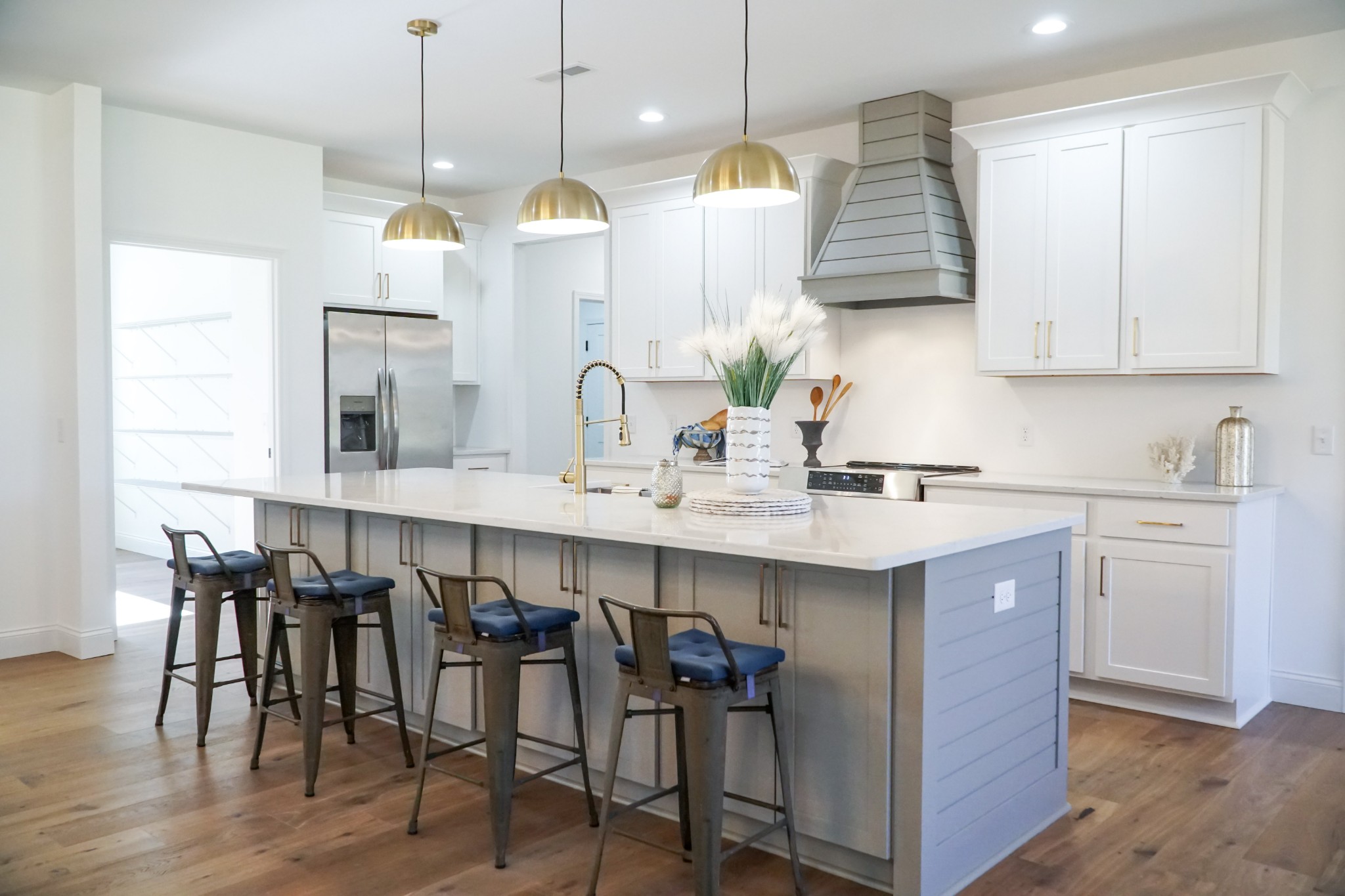 8203 Cookeville Boatdock Road Baxter, TN 38544 - Photo 13 of 64 a kitchen with kitchen island stainless steel appliances a table chairs sink and wooden floor