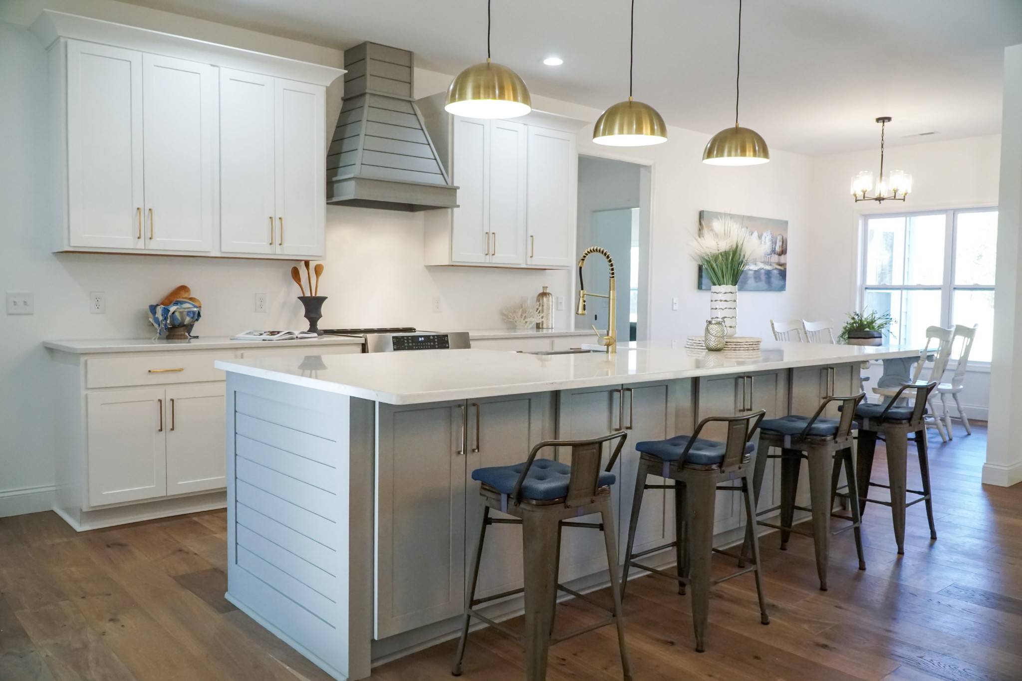 8203 Cookeville Boatdock Road Baxter, TN 38544 - Photo 24 of 64 a kitchen with stainless steel appliances granite countertop a table chairs white cabinets and a wooden floor