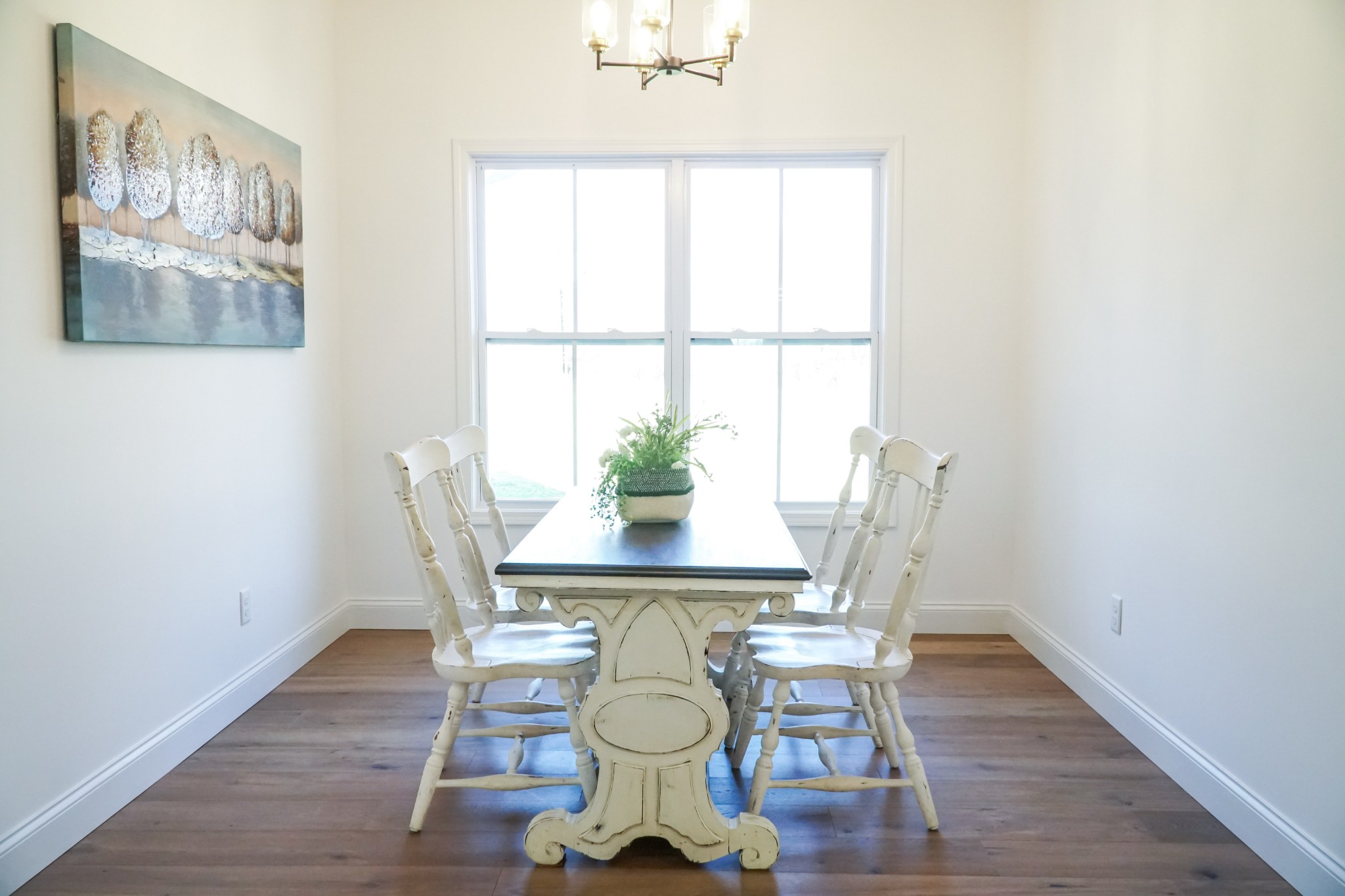 8203 Cookeville Boatdock Road Baxter, TN 38544 - Photo 26 of 64 a dining room with furniture a potted plant and wooden floor