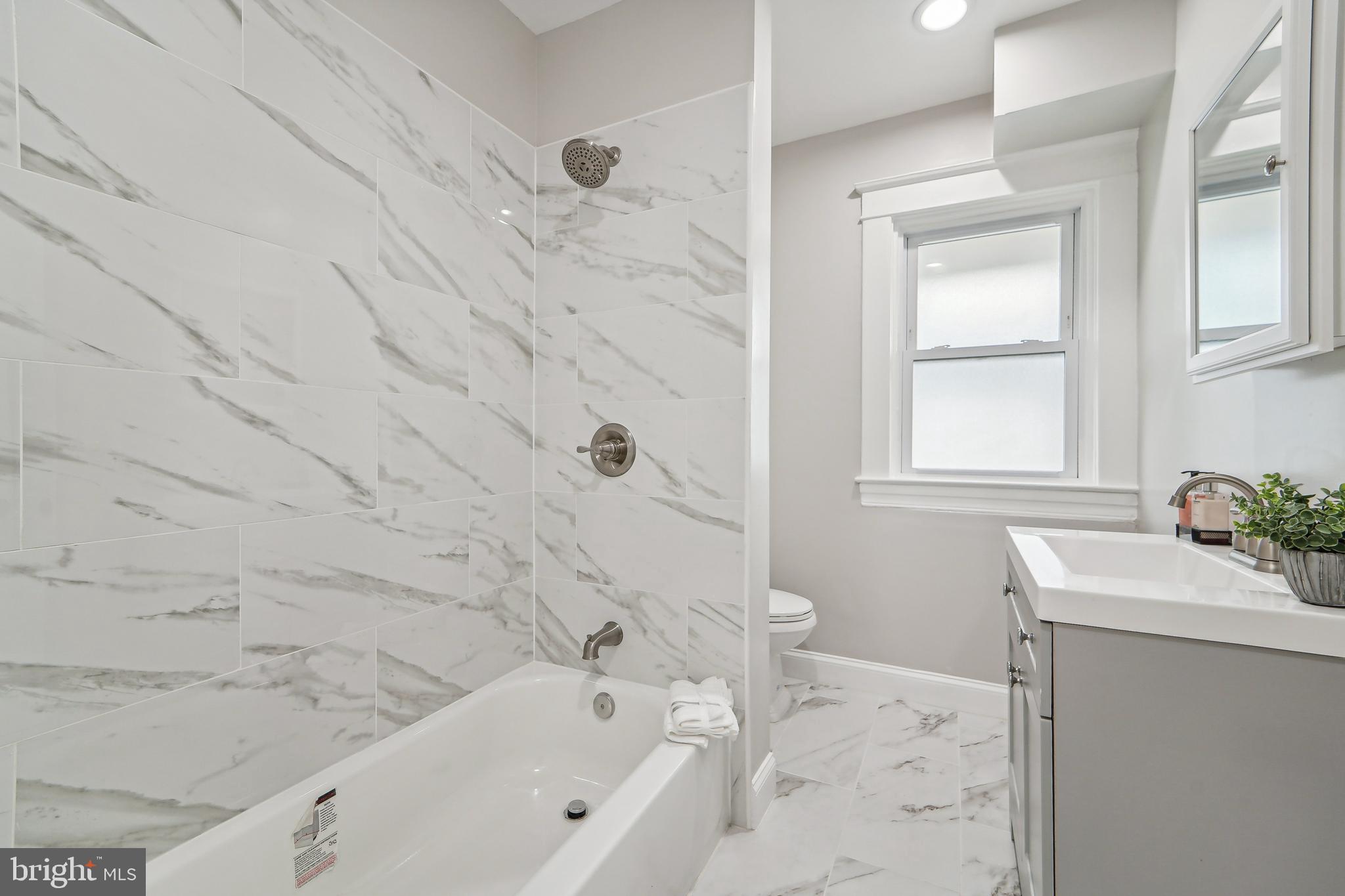 3911 Chatham Road Baltimore, MD 21207 - Photo 18 of 54 Updated guest bathroom with natural light
