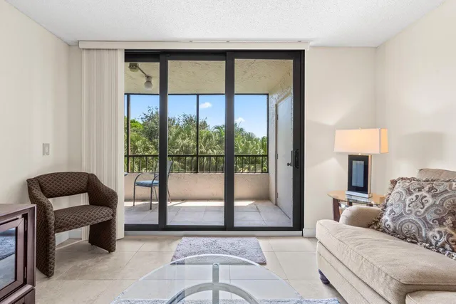 a bedroom with a large bed and a large window