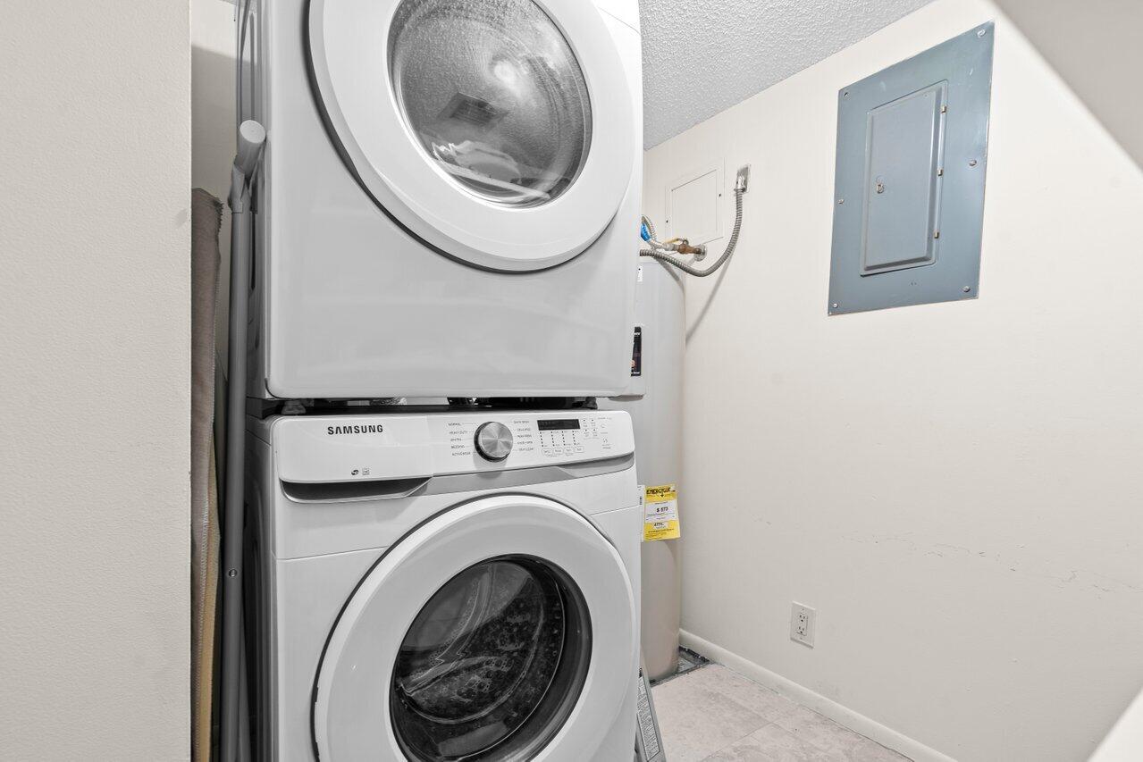 2070 Homewood Boulevard, Unit 4140 Delray Beach, FL 33445 - Photo 20 of 28 a utility room with dryer and washer