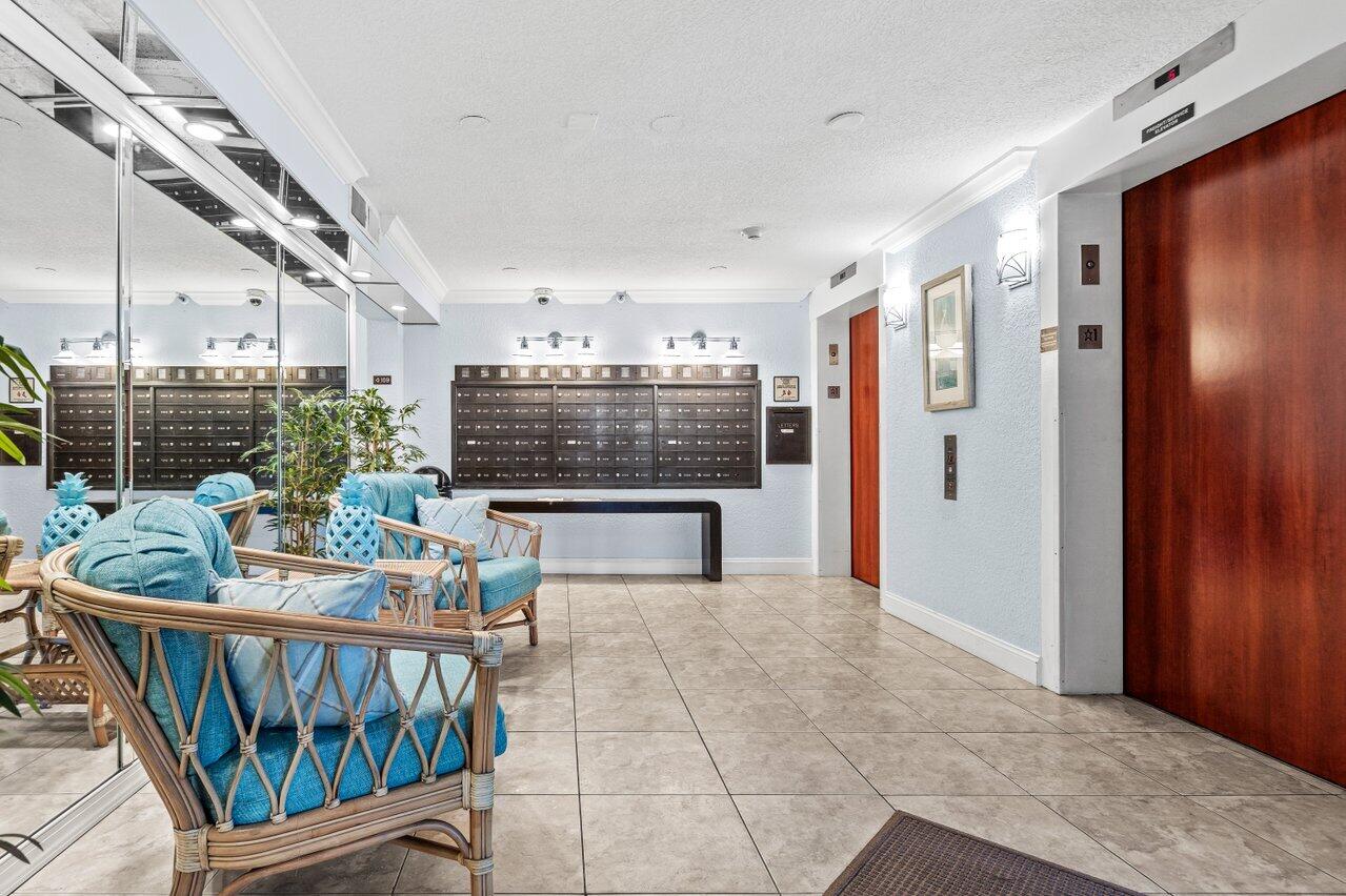 2070 Homewood Boulevard, Unit 4140 Delray Beach, FL 33445 - Photo 24 of 28 a view of a balcony and chairs