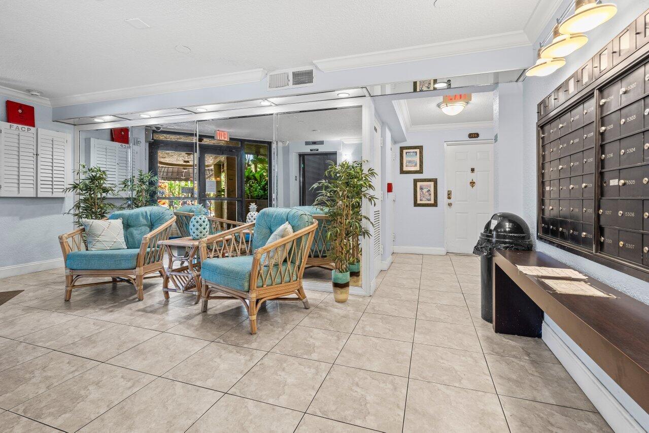 2070 Homewood Boulevard, Unit 4140 Delray Beach, FL 33445 - Photo 25 of 28 a lobby with furniture and window