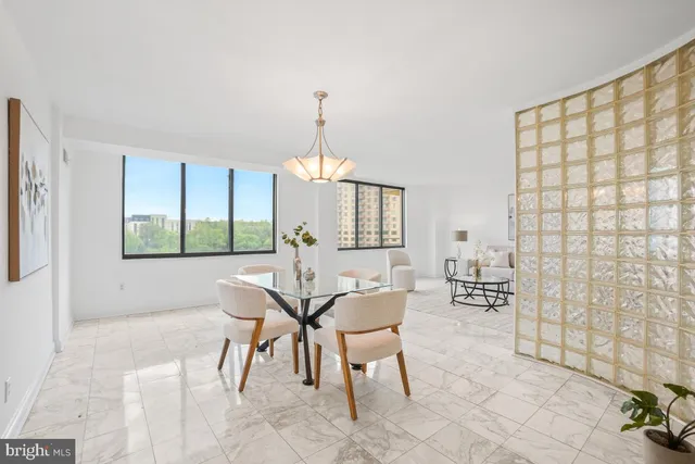 a view of a dining room with furniture and window