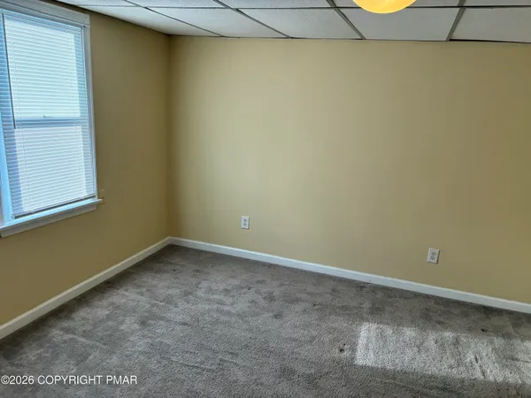 a view of a room that has a window