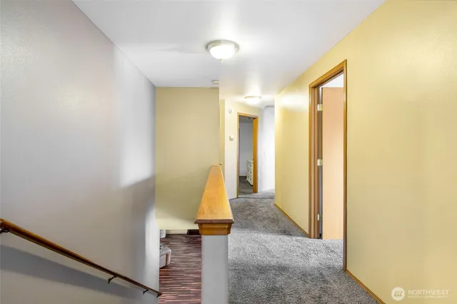 a view of a bathroom with a tub and shower