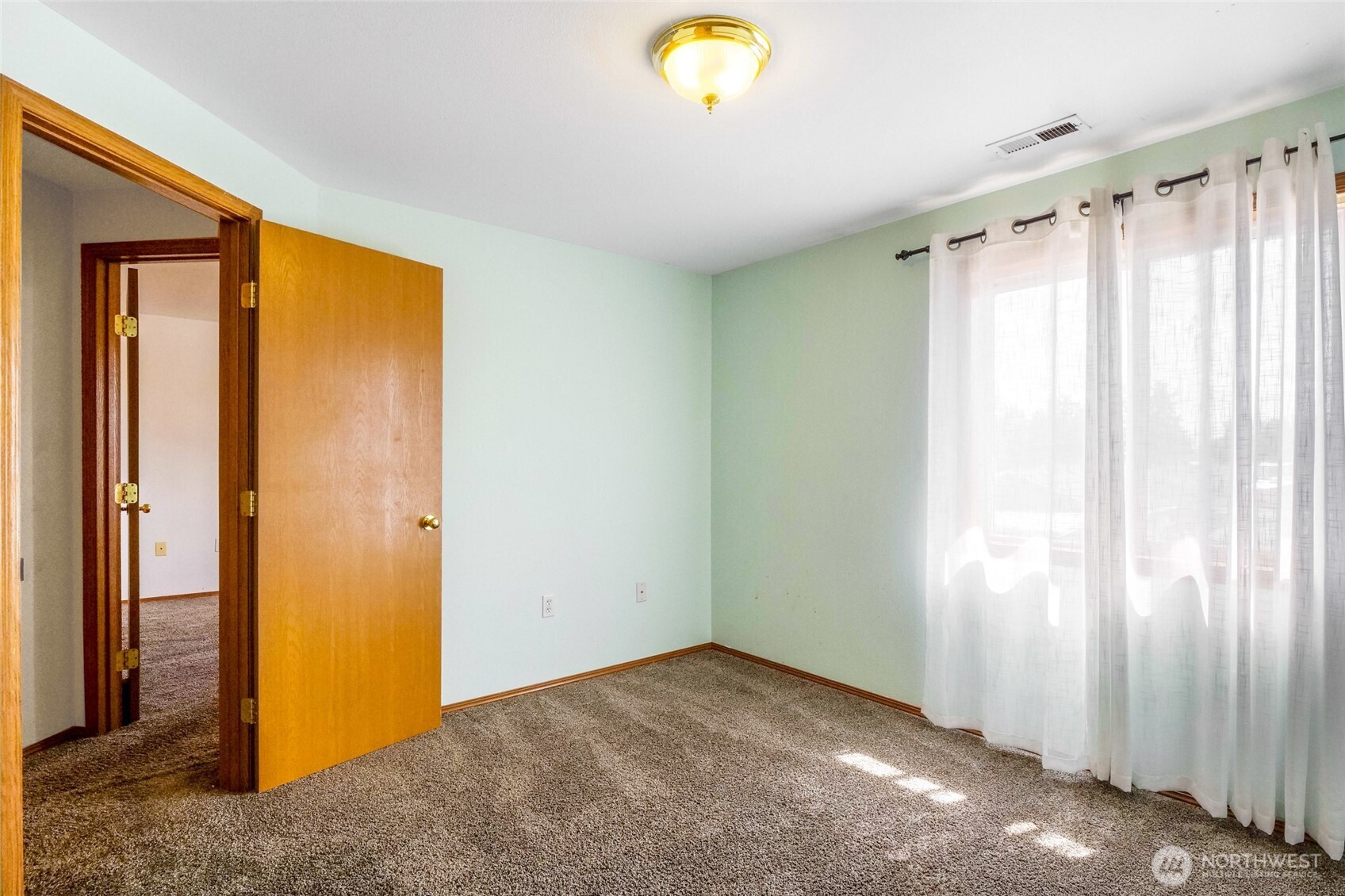804 Sycamore Lane Moses Lake, WA 98837 - Photo 28 of 40 a view of a room with a window and brick walls