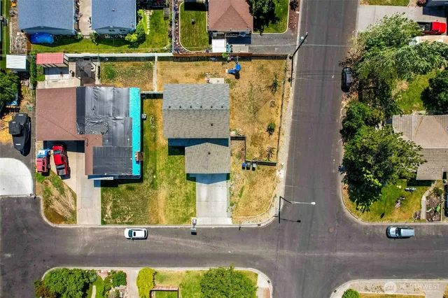 an aerial view of residential houses with outdoor space