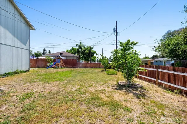 a backyard of a house with lots of green space