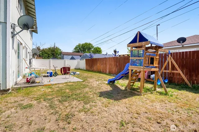 a view of a backyard of the house