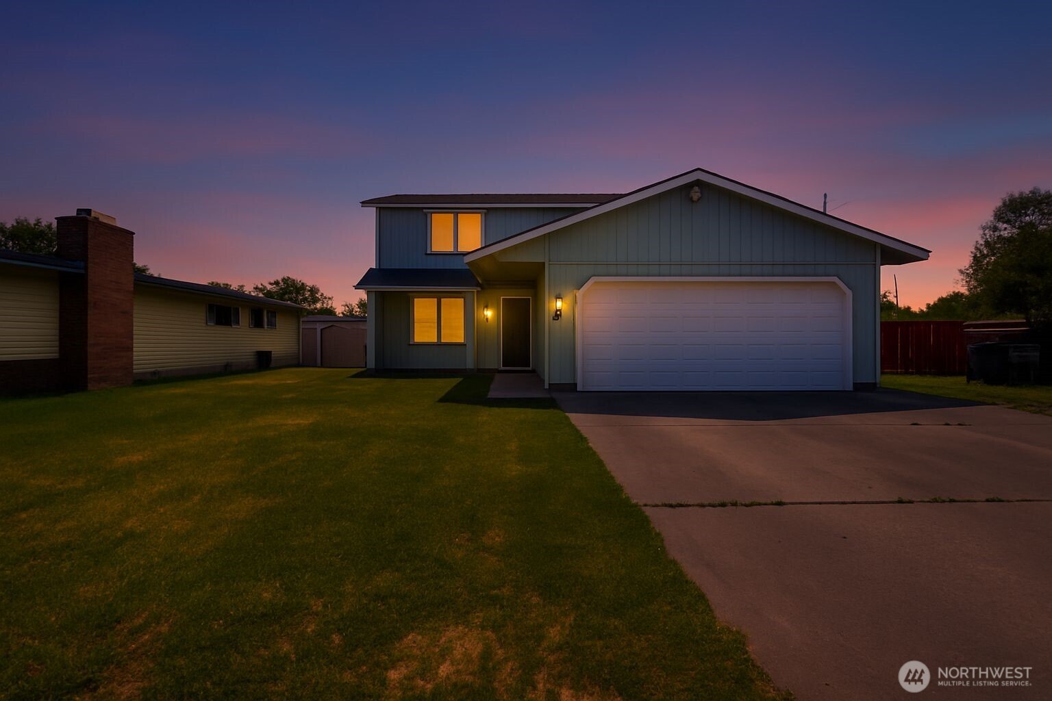804 Sycamore Lane Moses Lake, WA 98837 - Photo 40 of 40 a front view of a house with a yard and garage