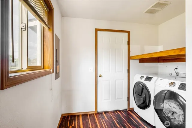 a view of storage and utility room with washer and dryer