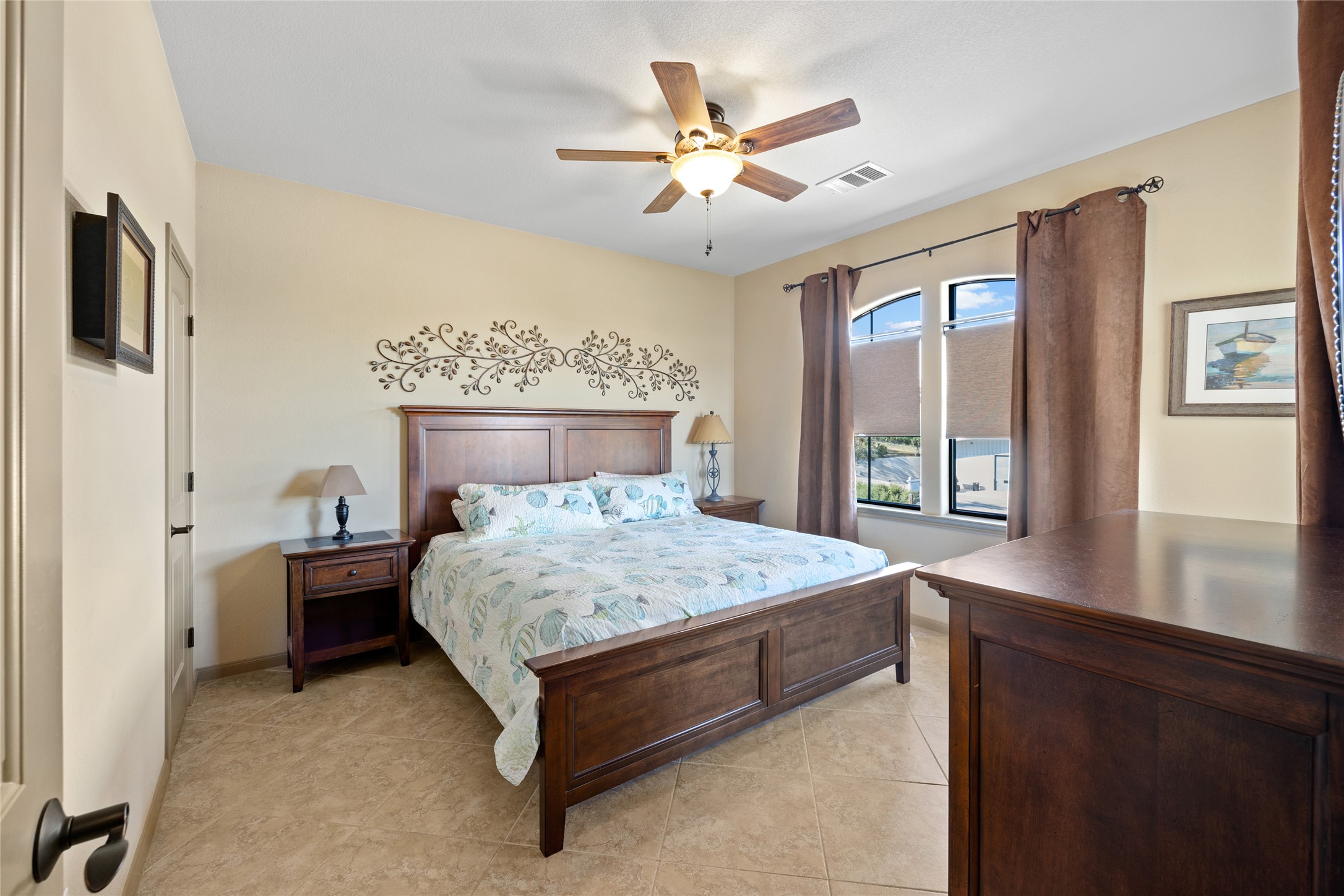 1690 Hickory Creek Road Marble Falls, TX 78654 - Photo 10 of 25 Bedroom featuring ceiling fan and light tile patterned floors