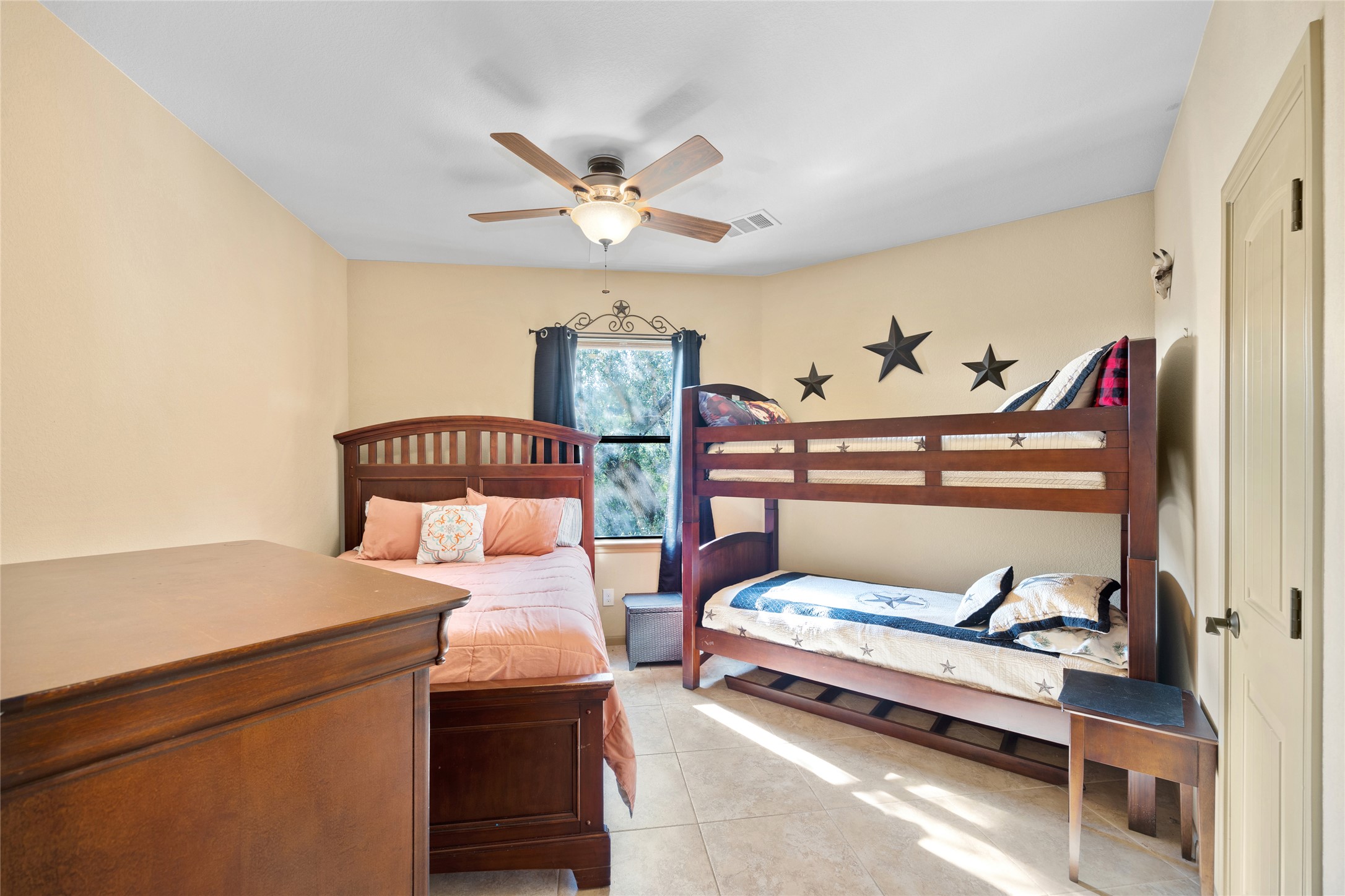 1690 Hickory Creek Road Marble Falls, TX 78654 - Photo 14 of 25 Bedroom featuring ceiling fan and light tile patterned floors