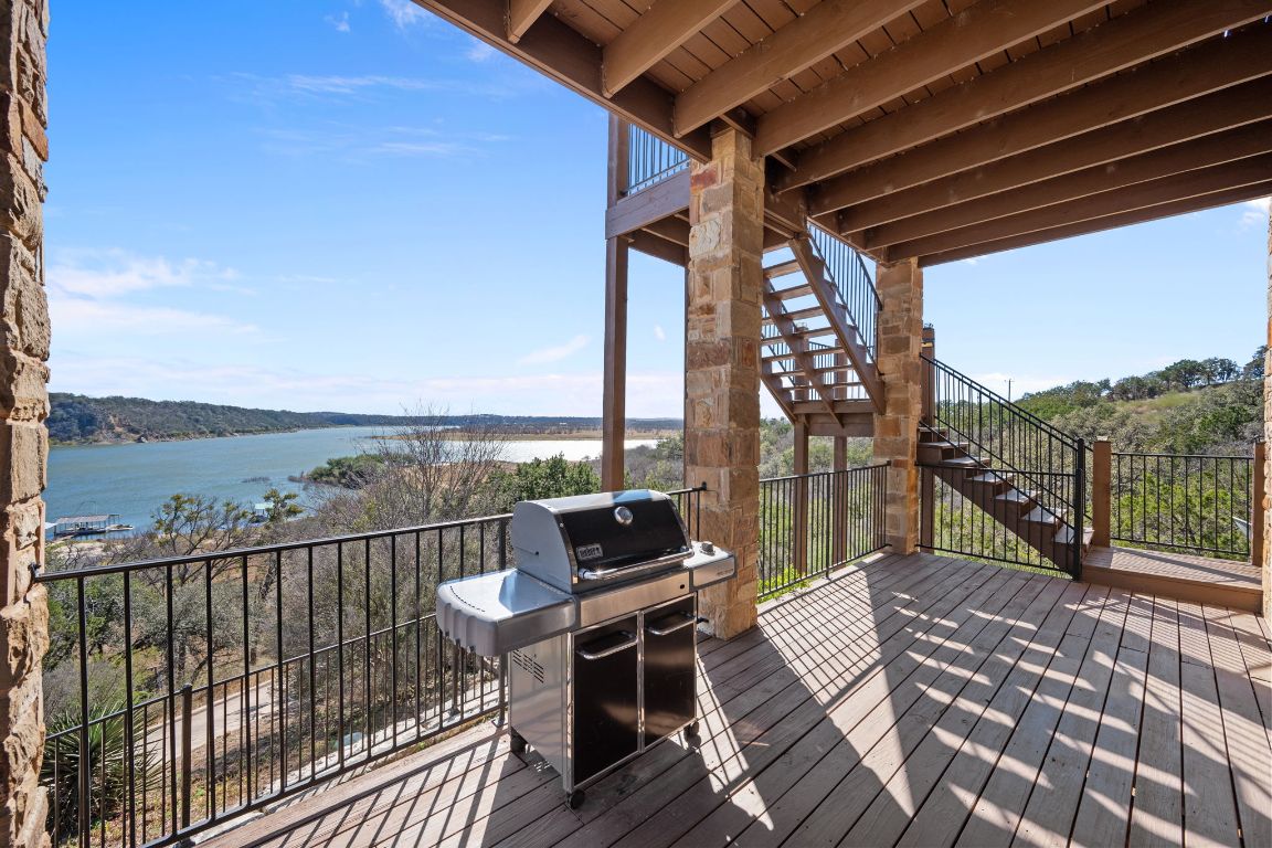 1690 Hickory Creek Road Marble Falls, TX 78654 - Photo 15 of 25 Deck featuring grilling area, stairs, and a water view