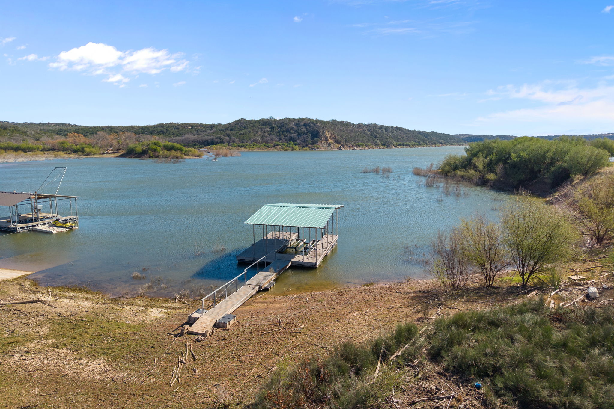 1690 Hickory Creek Road Marble Falls, TX 78654 - Photo 2 of 25 Dock area featuring a water view and boat lift
