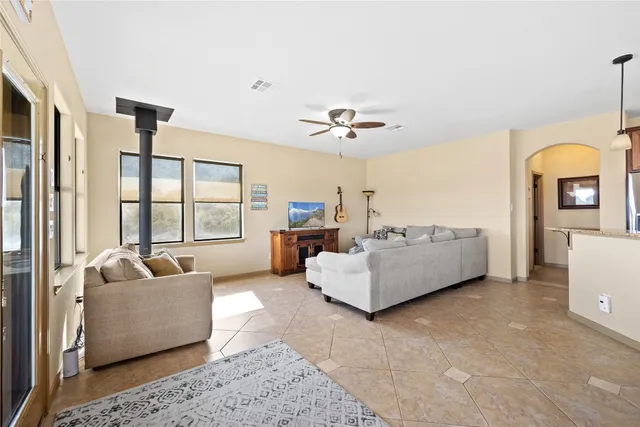 a living room with furniture and a large window