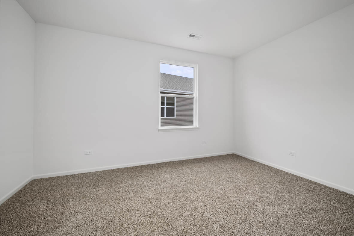 7676 West 106th Place Crown Point, IN 46307 - Photo 11 of 13 an empty room with a window