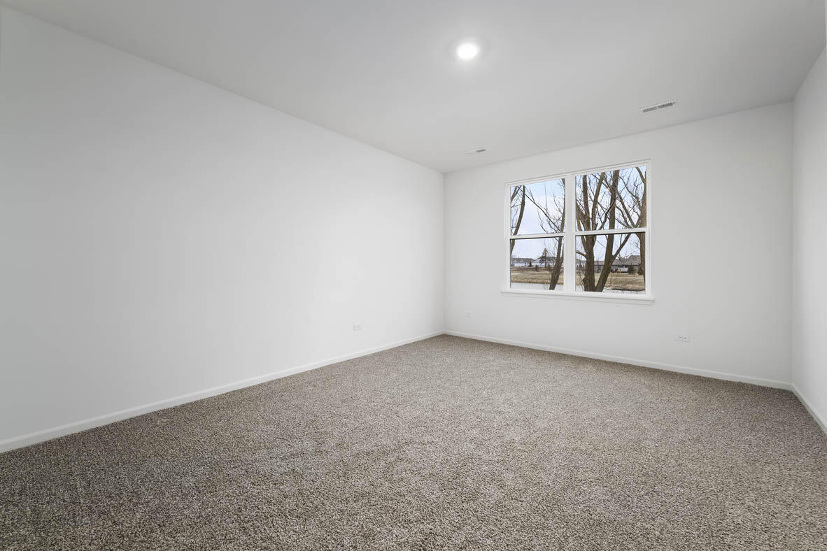 7676 West 106th Place Crown Point, IN 46307 - Photo 9 of 13 an empty room with windows and closet