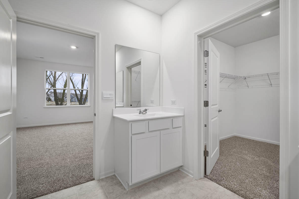 7676 West 106th Place Crown Point, IN 46307 - Photo 10 of 13 a bathroom with a sink and mirror