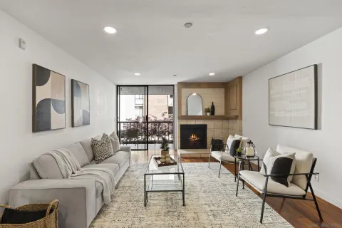 a living room with furniture and a fireplace
