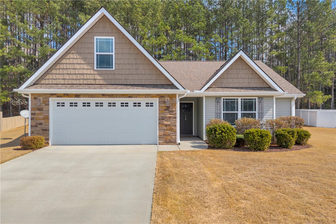 138 Madison Pointe Drive Seneca, SC 29678 - Photo 1 of 42 This charming home features a classic design with a welcoming facade and lush landscaping.